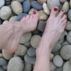 Foot torture walking on rocks and sharp pebbles video and photos